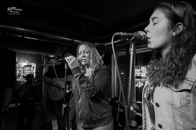 Laniece and Elianna singing at the Roughed Up Duck in Laramie